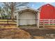 Metal-framed hay feeder in a barnyard setting at 3433 Grey Rd, Davidson, NC 28036