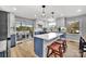 Modern kitchen with white and blue cabinets, quartz countertops, and an island at 3433 Grey Rd, Davidson, NC 28036