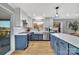 Modern kitchen with white and blue cabinets, quartz countertops, and a farmhouse sink at 3433 Grey Rd, Davidson, NC 28036