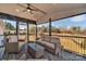 Relaxing screened porch with wicker furniture and view of the backyard at 3433 Grey Rd, Davidson, NC 28036