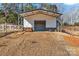 Metal storage shed with double doors and a covered overhang at 3433 Grey Rd, Davidson, NC 28036