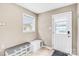 Mud room with a window, storage bench, and a door to the outside provides a transition space at 445 Providence Rd, Lancaster, SC 29720