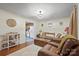 Living room with couch, chairs, and view into kitchen at 522 State St, Lincolnton, NC 28092