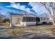 A backyard featuring a screened-in porch and a patio area perfect for outdoor living at 6305 Dale Ave, Charlotte, NC 28212