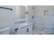 Modern bathroom featuring a stylish vanity, marble tiling in the shower and flooring, and contemporary fixtures at 6305 Dale Ave, Charlotte, NC 28212