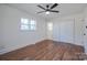 This light and airy bedroom has hardwood floors, a ceiling fan, and a double door closet at 6305 Dale Ave, Charlotte, NC 28212