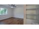 Bedroom with hardwood floors, natural light, and an adjacent closet at 6305 Dale Ave, Charlotte, NC 28212