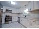 Bright kitchen featuring new appliances, stone countertops, and ample cabinet space at 6305 Dale Ave, Charlotte, NC 28212