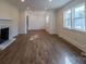 Spacious living room boasting new hardwood floors, natural light, and fresh paint throughout at 6305 Dale Ave, Charlotte, NC 28212