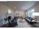Bright and staged living room with a fireplace, hardwood floors, and plenty of natural light at 6305 Dale Ave, Charlotte, NC 28212