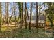 House nestled in a wooded backyard with a large deck at 69 Honeysuckle Woods, Clover, SC 29710