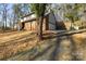 Brick house with a driveway and mature trees in the yard at 69 Honeysuckle Woods, Clover, SC 29710