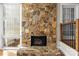 Stone fireplace with large hearth in a cozy living room at 69 Honeysuckle Woods, Clover, SC 29710