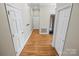 Hardwood floor hallway with multiple doors leading to different rooms at 69 Honeysuckle Woods, Clover, SC 29710