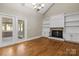 Living room with fireplace, built-in shelving, and hardwood floors at 69 Honeysuckle Woods, Clover, SC 29710