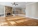 Spacious living room featuring hardwood floors and stone fireplace at 69 Honeysuckle Woods, Clover, SC 29710