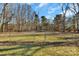 Large backyard with a partial fence line and mature trees at 1080 Nalley Rd, Rock Hill, SC 29732