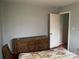 Bedroom with dresser and carpeting at 1108 Cone Ave, Pineville, NC 28134