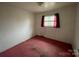 Simple bedroom with pink carpet and window at 1108 Cone Ave, Pineville, NC 28134