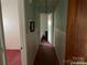 Hallway with light green walls and pink carpet at 1108 Cone Ave, Pineville, NC 28134
