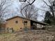 Brick ranch house with carport and fenced yard at 1108 Cone Ave, Pineville, NC 28134