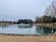 Scenic lake view with walking path and fountain at 1108 Cone Ave, Pineville, NC 28134