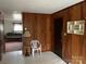 Living room with wood paneling and a glimpse of the sofa at 1108 Cone Ave, Pineville, NC 28134