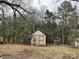 Small storage shed nestled in the backyard at 1108 Cone Ave, Pineville, NC 28134