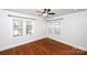 Well-lit bedroom featuring hardwood floors and window blinds at 1250 Reese Roach Rd, Rock Hill, SC 29730