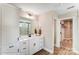 Bright bathroom featuring a double vanity, linen closet, and enclosed shower at 128 Ballantree Rd # 46, Mooresville, NC 28115