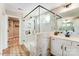 Modern bathroom with a glass-enclosed shower, marble tile, and double vanity at 128 Ballantree Rd # 46, Mooresville, NC 28115