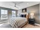 Comfortable bedroom filled with natural light and showcasing a ceiling fan, soft carpet, and neutral tones at 128 Ballantree Rd # 46, Mooresville, NC 28115