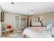 Cozy bedroom with soft lighting, accent chair, plush rug, ceiling fan, and a delightful view of a bedroom closet at 128 Ballantree Rd # 46, Mooresville, NC 28115