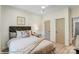 Cozy bedroom with neutral tones, a padded headboard, and two closets at 128 Ballantree Rd # 46, Mooresville, NC 28115