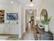 Bright entryway featuring a console table with decor, wood floors, and stylish lighting at 128 Ballantree Rd # 46, Mooresville, NC 28115
