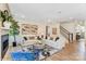 Bright living room features hardwood floors, fireplace, and two couches at 128 Ballantree Rd # 46, Mooresville, NC 28115