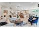 Open-concept living room with modern kitchen, hardwood floors and ceiling fan at 128 Ballantree Rd # 46, Mooresville, NC 28115