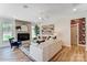 Cozy living room with a fireplace, stylish decor, and hardwood floors at 128 Ballantree Rd # 46, Mooresville, NC 28115