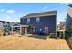 Spacious backyard with a patio and a view of neighboring homes at 14247 Canemeadow Dr, Charlotte, NC 28278