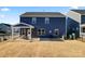 Spacious backyard with a patio and a view of neighboring homes at 14247 Canemeadow Dr, Charlotte, NC 28278