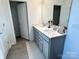 Bathroom with a double vanity, soft-close drawers, and framed mirrors at 14247 Canemeadow Dr, Charlotte, NC 28278