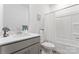 Clean bathroom with a gray vanity, bathtub, and shower at 14247 Canemeadow Dr, Charlotte, NC 28278