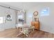 Bright dining area with white table and chairs, light wood floors, and natural light at 14247 Canemeadow Dr, Charlotte, NC 28278