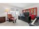 Home office with built-in shelving, a large desk, and comfortable seating at 14247 Canemeadow Dr, Charlotte, NC 28278