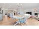 Open concept kitchen and living area with modern appliances and a cozy fireplace at 14247 Canemeadow Dr, Charlotte, NC 28278