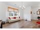 Living room with light beige couch and red accent pillows at 14247 Canemeadow Dr, Charlotte, NC 28278