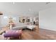 Modern living room with sectional sofa, large windows, and an open floor plan at 14247 Canemeadow Dr, Charlotte, NC 28278