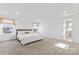 Spacious main bedroom with carpeted floors and an ensuite bathroom at 14247 Canemeadow Dr, Charlotte, NC 28278