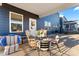 Relaxing patio area with seating and a view of the backyard at 14247 Canemeadow Dr, Charlotte, NC 28278
