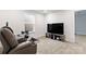 Recreation room with a large TV and comfortable recliner at 14247 Canemeadow Dr, Charlotte, NC 28278